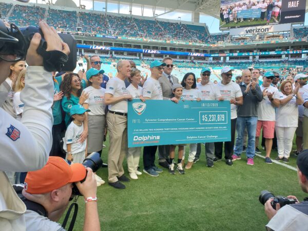 Dolphins and the DCC Give Check for $5.2 Million